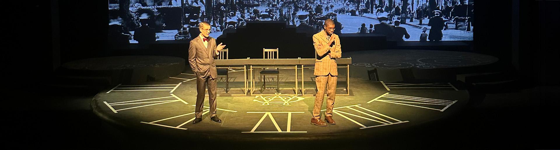 Isaac Ajayi and Peter Larson acting onstage in &quot;Radium Girls.&quot;